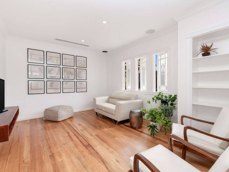 Freshly painted living room with wood floors